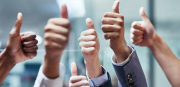 Shot of a group of hands showing thumbs up